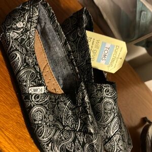 Brand new Tom’s slip on women’s size 7 black-and-white